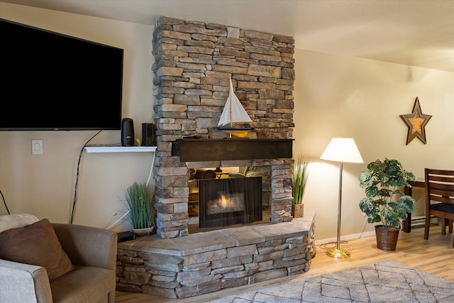 living room featuring hardwood / wood-style flooring and a fireplace