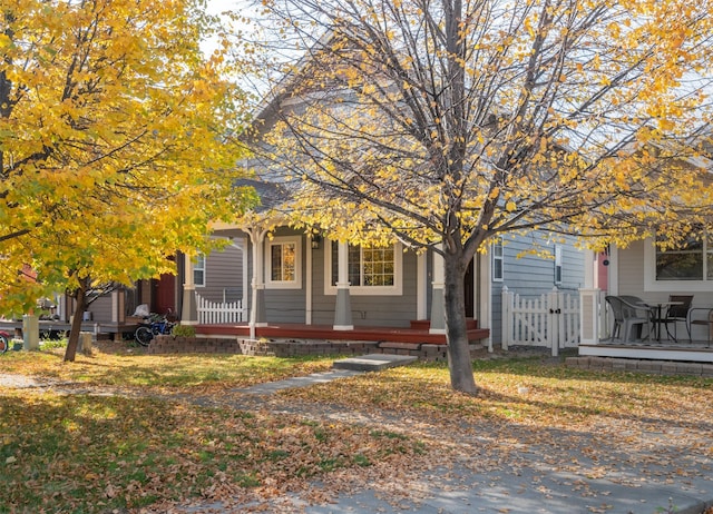 obstructed view of property with covered porch