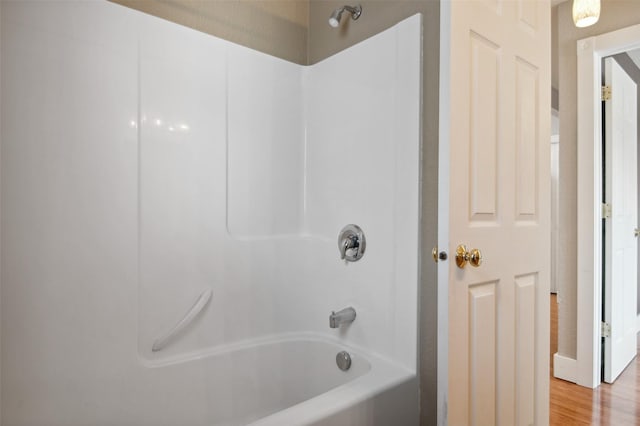 bathroom featuring shower / bathing tub combination and wood-type flooring