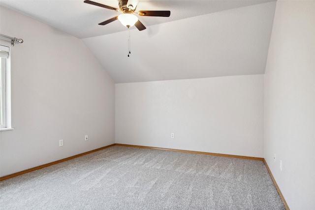 bonus room featuring carpet, vaulted ceiling, and ceiling fan