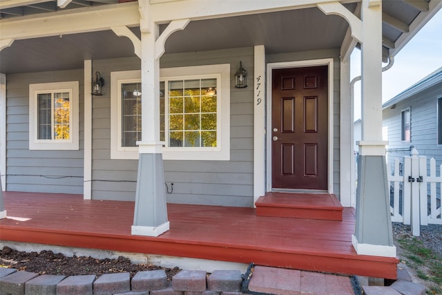 doorway to property featuring a porch