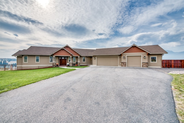 view of front facade featuring a front yard and a garage