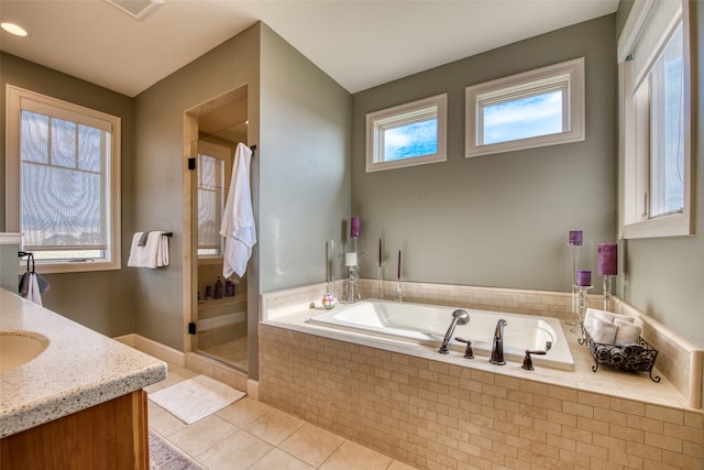 bathroom featuring tile patterned floors, vanity, and separate shower and tub