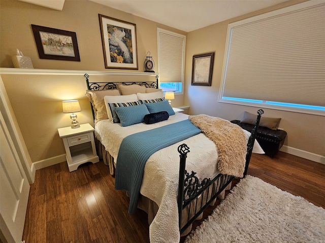 bedroom featuring dark wood-type flooring