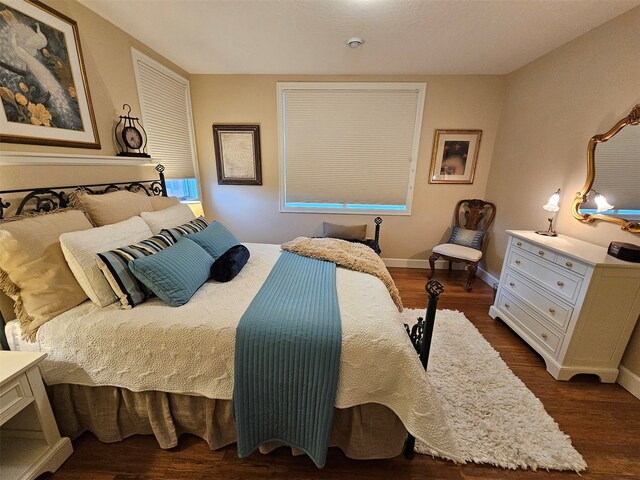 bedroom featuring dark hardwood / wood-style floors