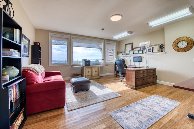 office space with light wood-type flooring