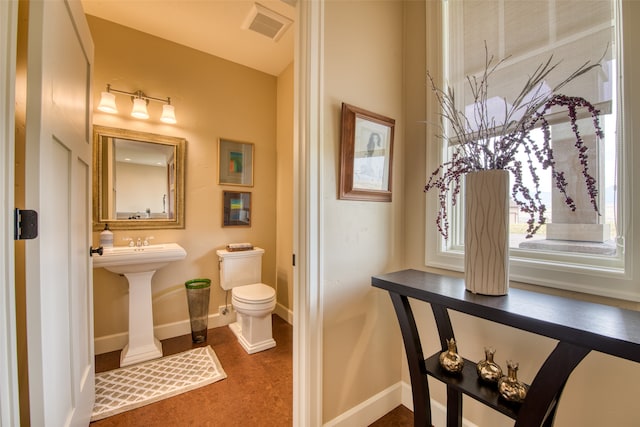 bathroom with toilet and sink