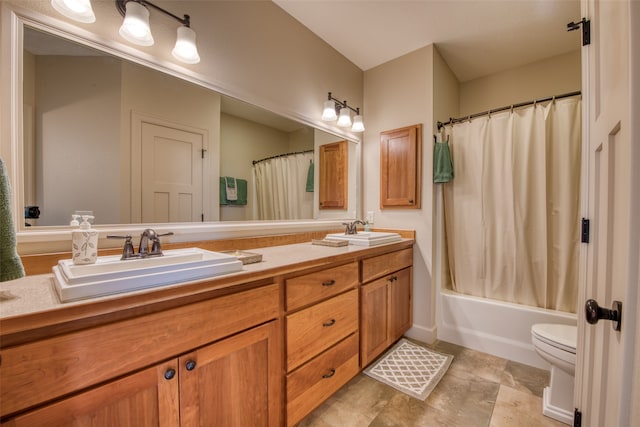 full bathroom featuring vanity, shower / bath combination with curtain, and toilet