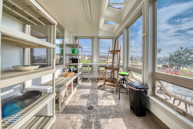 sunroom with lofted ceiling with skylight