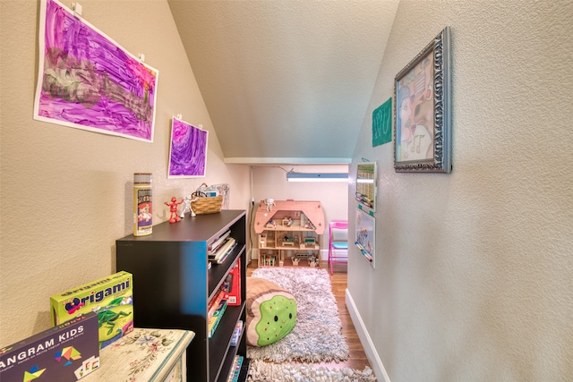 rec room with hardwood / wood-style flooring