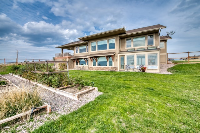 rear view of house with a yard