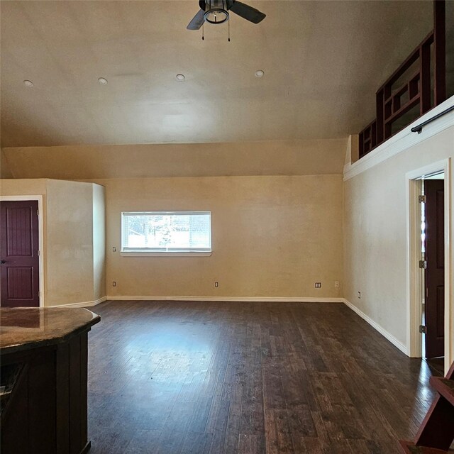 unfurnished living room with ceiling fan and dark hardwood / wood-style flooring