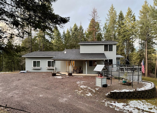 rear view of house featuring a patio area and a deck