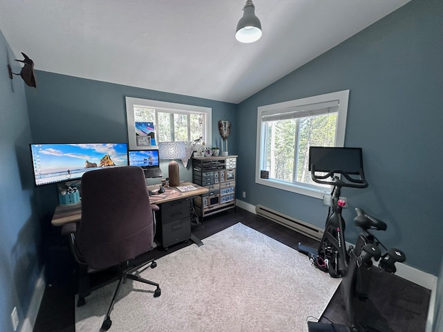 office featuring a wealth of natural light, lofted ceiling, and a baseboard heating unit