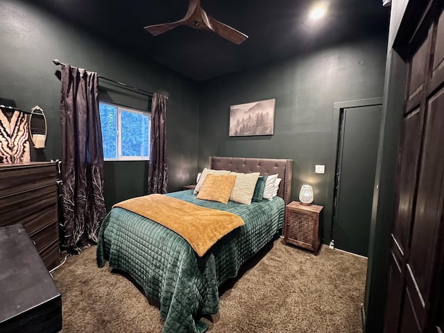 bedroom featuring ceiling fan and carpet