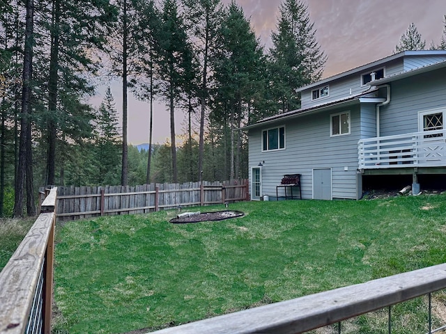 yard at dusk with a deck