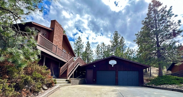 view of front of property with a garage and a balcony