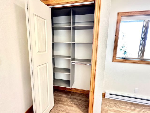 closet featuring a baseboard radiator