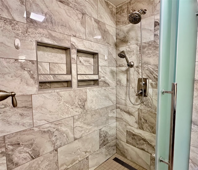 bathroom featuring tiled shower