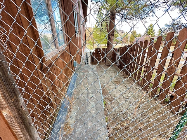 view of gate featuring a fenced backyard