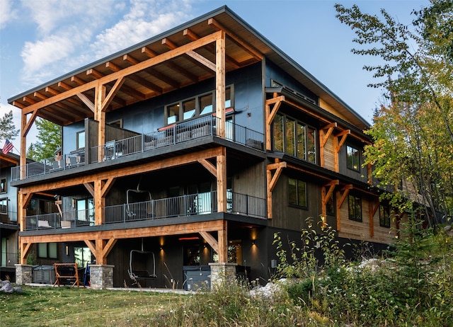 rear view of property with a balcony