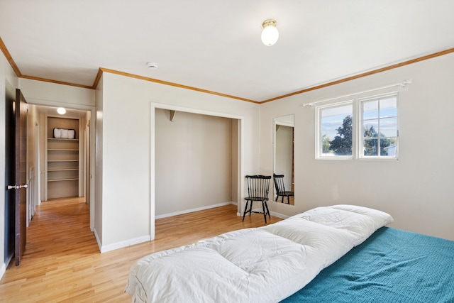 bedroom with wood-type flooring and ornamental molding