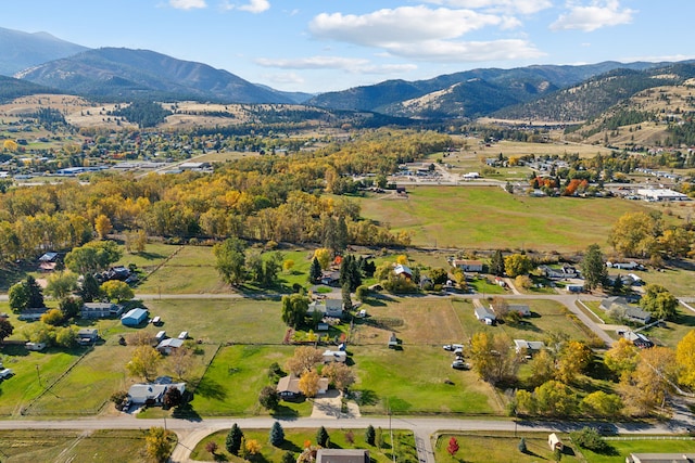 birds eye view of property featuring a mountain view