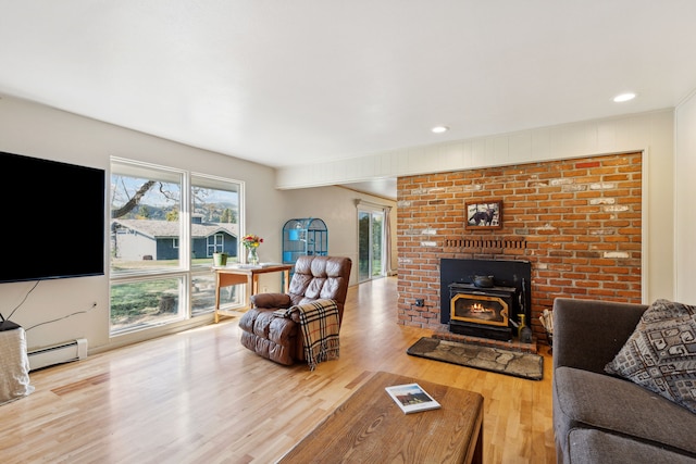 living room featuring hardwood / wood-style floors and baseboard heating