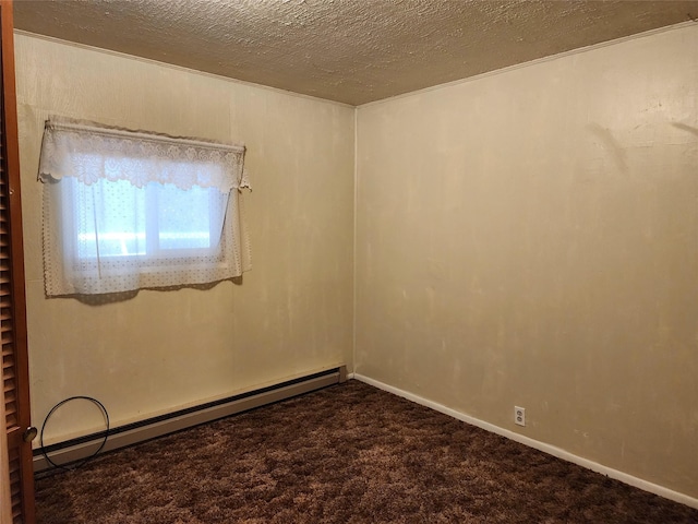 33762 US Highway 2, Libby, MT 59923 - carpeted empty room featuring a baseboard heating unit and a textured ceiling