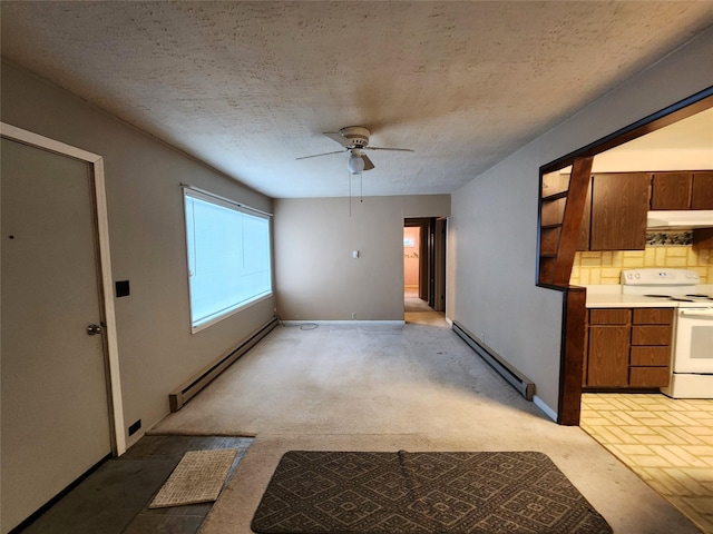 33762 US Highway 2, Libby, MT 59923 - unfurnished living room with baseboard heating, a baseboard radiator, ceiling fan, a textured ceiling, and light colored carpet
