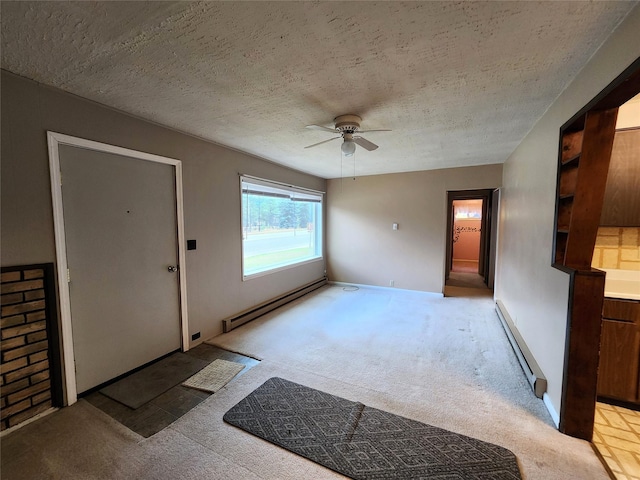 33762 US Highway 2, Libby, MT 59923 - foyer featuring a baseboard radiator, light carpet, a textured ceiling, and ceiling fan
