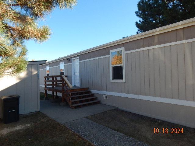 2922 Village Rd, Helena, MT 59602 - property entrance with a wooden deck and crawl space