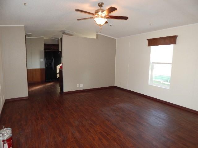 2922 Village Rd, Helena, MT 59602 - spare room featuring baseboards, wood finished floors, and ceiling fan
