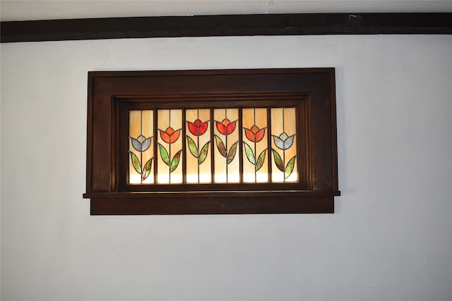 interior details featuring beamed ceiling