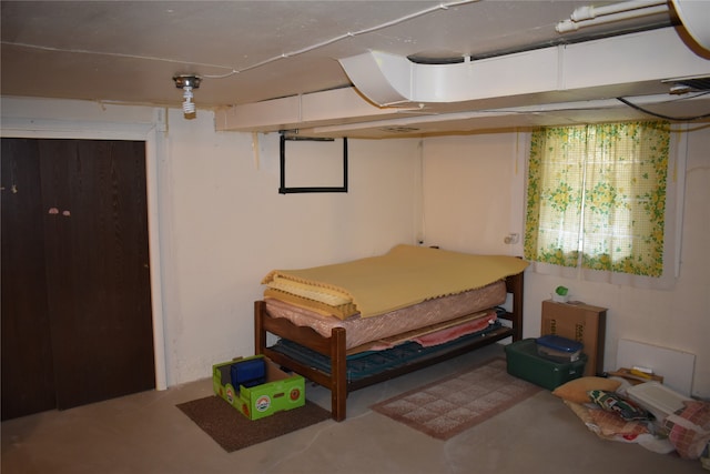 bedroom with concrete flooring