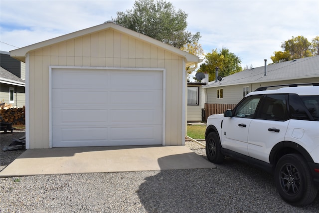 garage featuring wooden walls