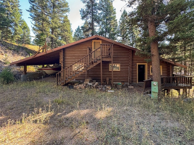 rear view of house with a deck