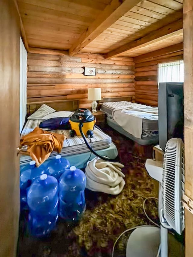 bedroom featuring rustic walls and wood ceiling