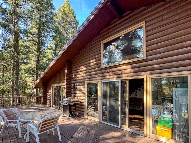 wooden terrace featuring area for grilling