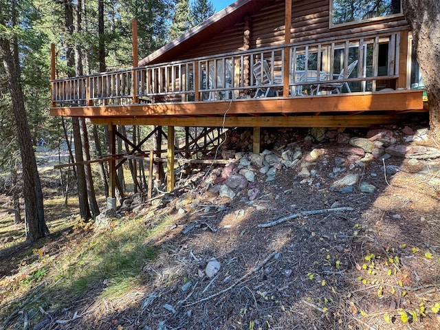 back of property featuring a wooden deck