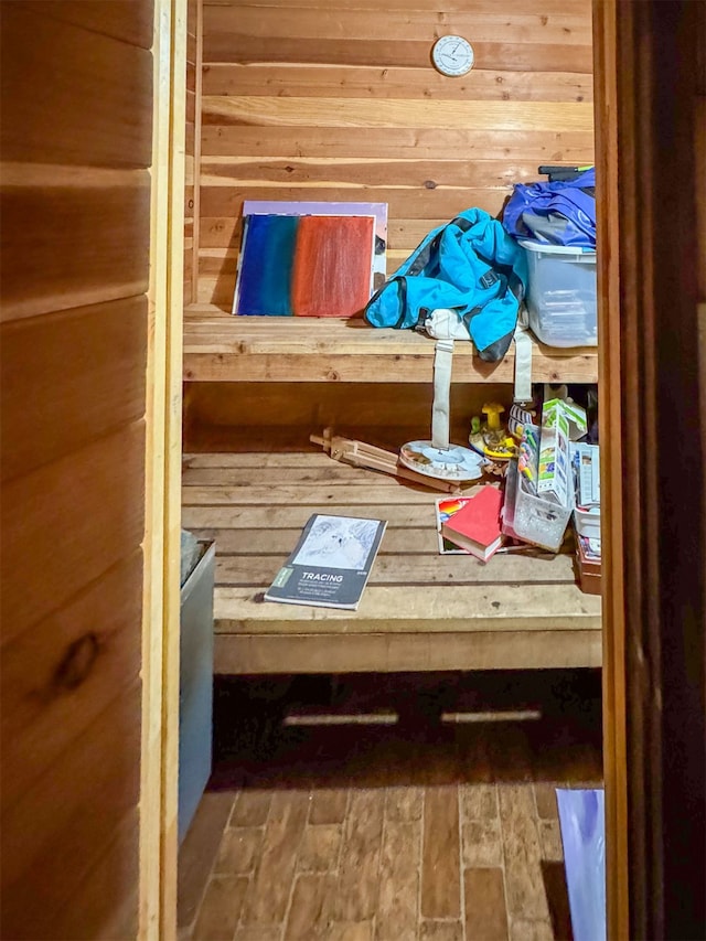 view of sauna featuring wood walls and hardwood / wood-style flooring