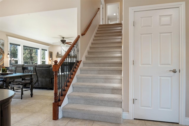 10636 Nez Perce Loop, Lolo, MT 59847 - stairway with a ceiling fan and tile patterned flooring