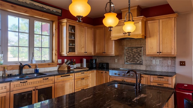4025 Sunset Ridge Dr, Helena, MT 59602 - kitchen with dark stone counters, decorative light fixtures, and a sink