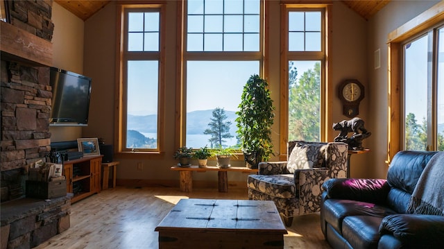 4025 Sunset Ridge Dr, Helena, MT 59602 - living room featuring wood ceiling, high vaulted ceiling, wood finished floors, and a fireplace