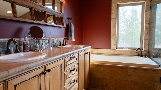 4025 Sunset Ridge Dr, Helena, MT 59602 - bathroom featuring double vanity, a garden tub, and a sink