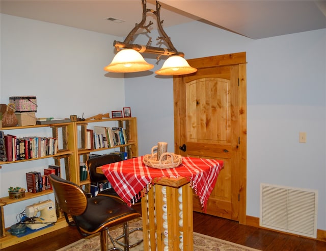 dining space featuring wood-type flooring