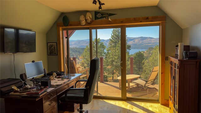 4025 Sunset Ridge Dr, Helena, MT 59602 - office area featuring lofted ceiling, a mountain view, wood finished floors, and plenty of natural light