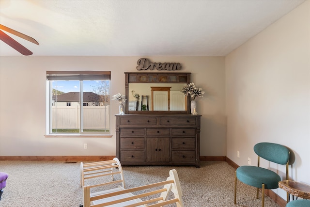 bedroom with light colored carpet and ceiling fan