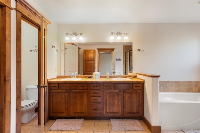 full bathroom with vanity, shower with separate bathtub, toilet, and tile patterned flooring