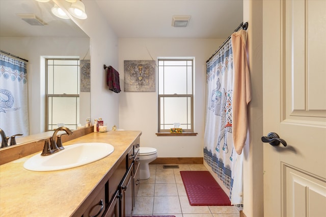 bathroom featuring vanity, a shower with shower curtain, toilet, and tile patterned flooring